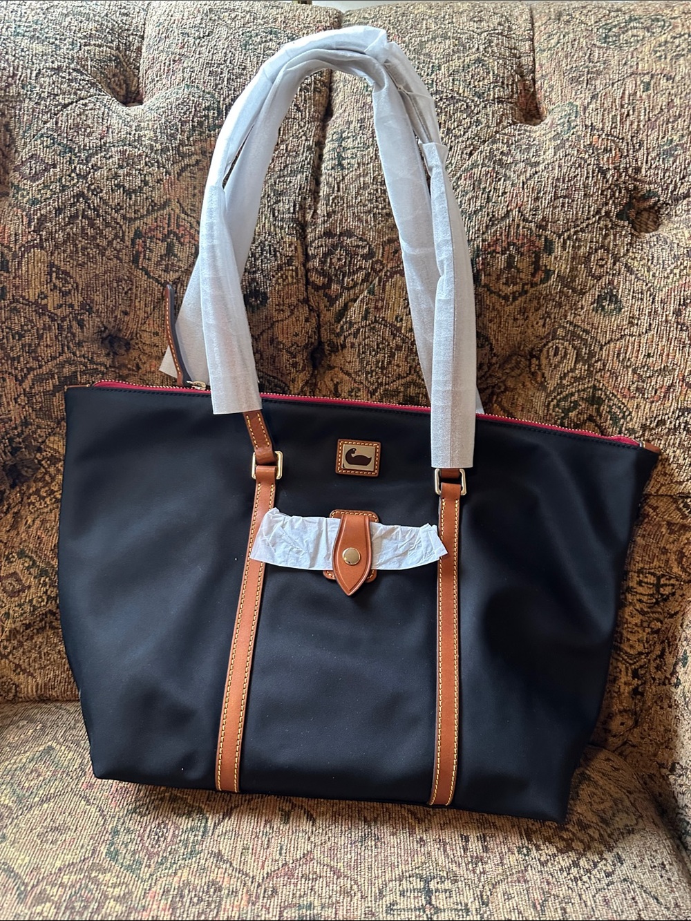 Dooney & Bourke Black Tote with Tan Trim key fob and matching small make up bag.